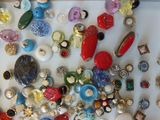 many different types of buttons on a white surface