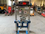 an image of a fork lifter in a warehouse with pallets and pallets