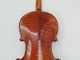 an old violin with a wooden back and a long neck