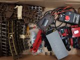 a box with a bunch of toy trains in it