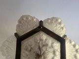 a clock that is on the wall in the corner of the room