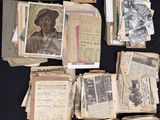 a pile of old papers with pictures of people on them