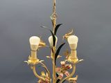 an image of a chandelier with flowers on it