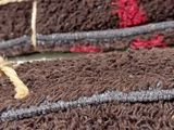 a chocolate cake with a train on it on a table