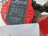 a close up of a red fire hydrant with a note attached to it