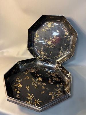 an image of a black and gold octagonal shaped box on a white background