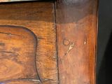 a wooden table with a marble top on it