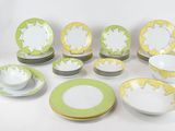 many plates and bowls that are sitting on a table
