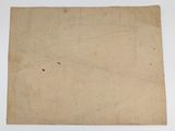 an old piece of paper sitting on top of a white table
