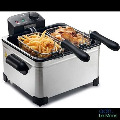 an image of a deep fryer with french fries in it