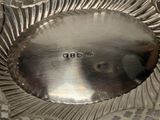 a silver plate that has a number on it