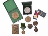 an image of a collection of medals including a medal, a medal, a medal, a medal, a medal, and a medal