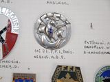 a lot of badges that are on a piece of paper