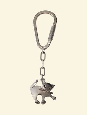 a keychain with an elephant on it that is attached to a chain