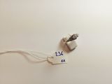 a tag that says 25 cents on it next to an earphone