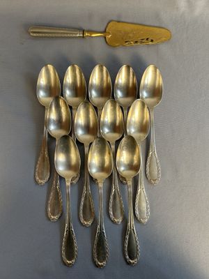 a lot of spoons and a spatula on the table
