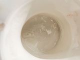 a close up view of a toilet bowl with a dirty lid