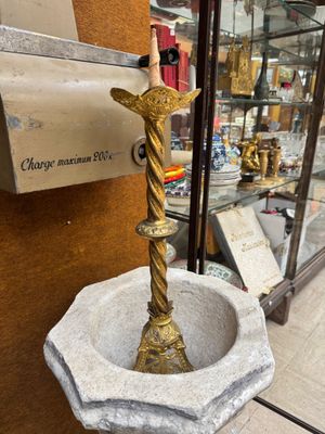 a statue of a bird on a pedestal in a store