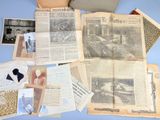a lot of old papers and pictures on the table