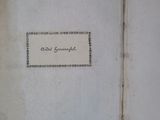 an open book with a picture of a woman ' s name on it