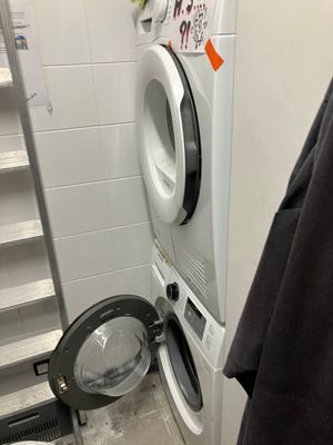 a washer and a dryer in a small room