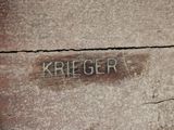 a sign that says kreger on the side of a building