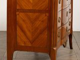 an image of a wooden chest of drawers on a hard wood floor