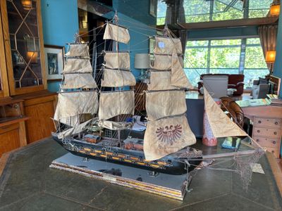 a model of a ship on a table in a room