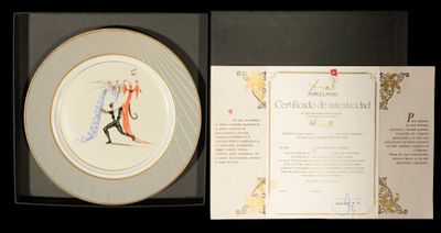 a plate with a picture of a man and a woman holding a tennis racquet