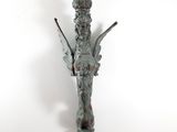 statue of a woman holding a spear and a bird on a white background