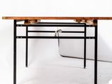 the table is made of wood and metal with a metal frame