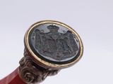 a bottle of wine with a seal on the top of it