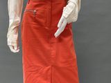 an image of a mannequin wearing a white shirt and red skirt