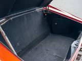 a trunk of a red car with its trunk open