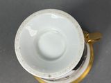 a cup and saucer sitting on top of each other