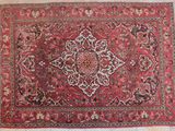 an antique persian rug with a medallion design on a white background