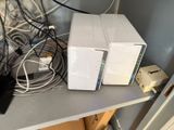 two white boxes sitting on top of a table