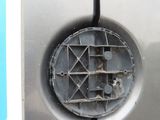 a close up of a car ' s door with a hole in it