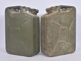 pair of green jerry canisters on a white background