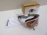 a box with a pair of ski goggles sitting on a table