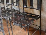 four chairs that are sitting in a row on the floor