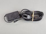 an image of a black charger and a cord on a table
