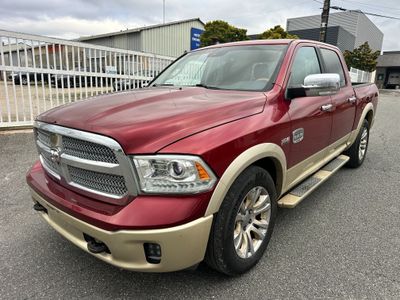 a picture of a red ram truck parked in a parking lot