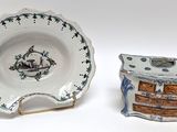 a small plate and a small bowl sitting next to each other