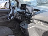 a car that has a laptop in the passenger seat