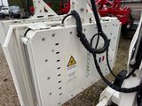 a white machine that is sitting on the ground