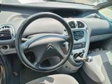 a steering wheel and dashboard of a small car