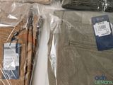 a bag of pants and a pair of shoes on a table