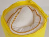 a yellow bag with a heart in it sitting on a table