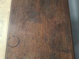 a wooden table with a drawer underneath it on a hard wood floor